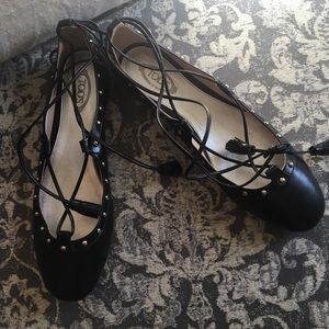 Tod’s black leather studded ankle wrap flats